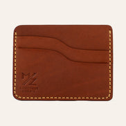 MZ Leather Craft yatay minimalist kiremit Buttero deri kartlık, boş kart yuvalarını ve pürüzsüz deri dokusunu gösteren düz ön görünüm, sarı el dikişleri ve kabartmalı MZ logosu