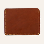 MZ Leather Craft yatay minimalist kiremit Buttero deri kartlık, temiz arka paneli ve çevreleyen sarı el dikişlerini gösteren arka görünüm