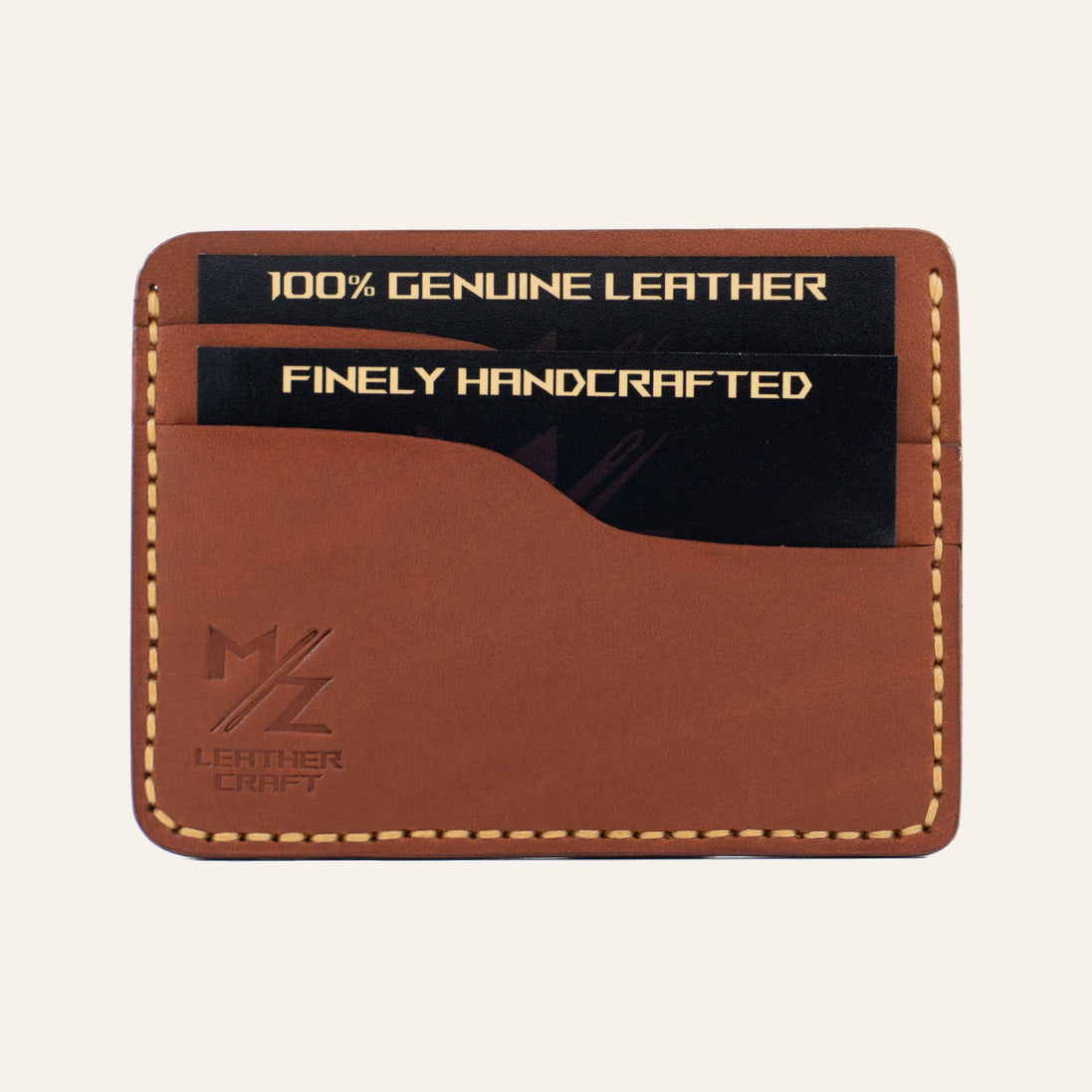 MZ Leather Craft yatay minimalist kiremit Buttero deri kartlık, kartlarla dolu önden görünüm, sarı el dikişleri ve sol alt köşede kabartmalı MZ logosu