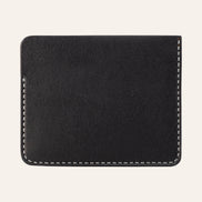 MZ Leather Craft siyah Pueblo deri ters cüzdan, kesintisiz düz deri paneli ve çevreleyen gri el dikişlerini gösteren arka görünüm